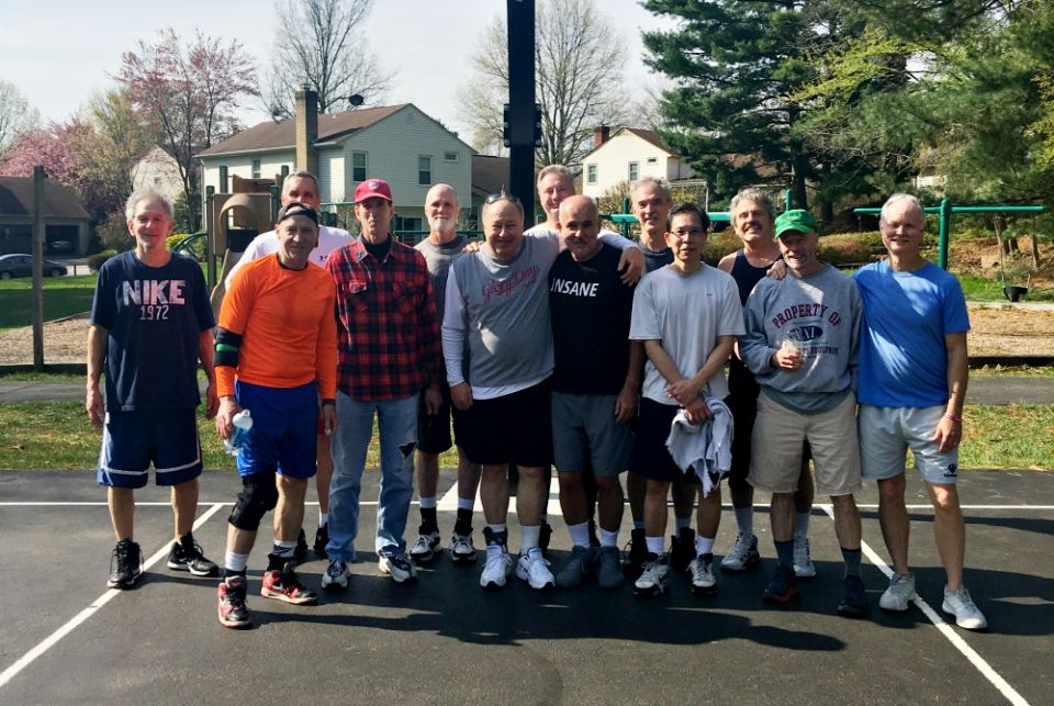 Jack McHale (center, black shirt) with friends at their weekly Sunday morning basketball games. McHale has recruited many of the men from these games to join on his trips into D.C. over the years. (Provided photo) Jack McHale (center, black shirt) with friends at their weekly Sunday morning basketball games. McHale has recruited many of the men from these games to join on his trips into D.C. over the years. (Provided photo)