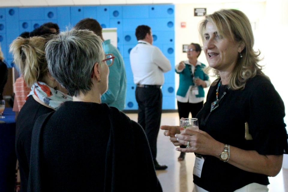 Dima Khoury, Miller Center mentor, talks with attendees at the San Francisco Bay Area GSBI Boost final presentation July 26. (Heather Adams) Dima Khoury, Miller Center mentor, talks with attendees at the San Francisco Bay Area GSBI Boost final presentation July 26. (Heather Adams)