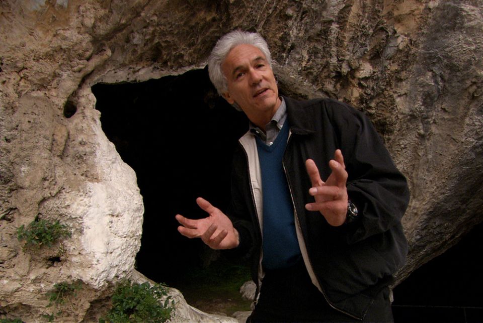 Brian Swimme stands outside the cave of Pythagoras on the island of Samos during "Journey of the Universe." (Courtesy of Journey of the Universe) Brian Swimme stands outside the cave of Pythagoras on the island of Samos during "Journey of the Universe." (Courtesy of Journey of the Universe)