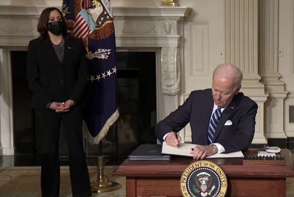 President Joe Biden, seated, signs "Executive Order on Tackling the Climate Crisis at Home and Abroad" Jan. 27, 2021. (NCR screenshot/The White House on YouTube) President Joe Biden, seated, signs "Executive Order on Tackling the Climate Crisis at Home and Abroad" Jan. 27, 2021. (NCR screenshot/The White House on YouTube)
