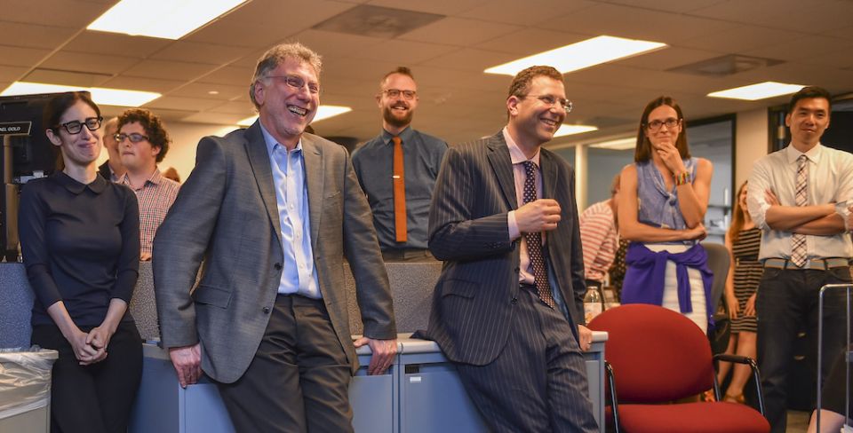 Executive Editor Martin Baron, third from left, laughs with his staff at the offices of The Washington Post. (Courtesy of The Washington Post)