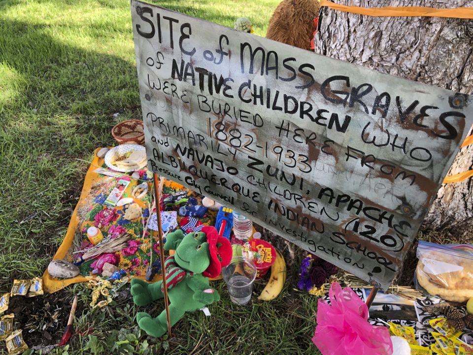 A makeshift memorial for the dozens of Indigenous children who died more than a century ago while attending a boarding school that was once located nearby is displayed under a tree in Albuquerque, N.M., on July 1, 2021 (AP Photo/Susan Montoya Bryan, File) A makeshift memorial for the dozens of Indigenous children who died more than a century ago while attending a boarding school that was once located nearby is displayed under a tree in Albuquerque, N.M., on July 1, 2021 (AP Photo/Susan Montoya Bryan, File)
