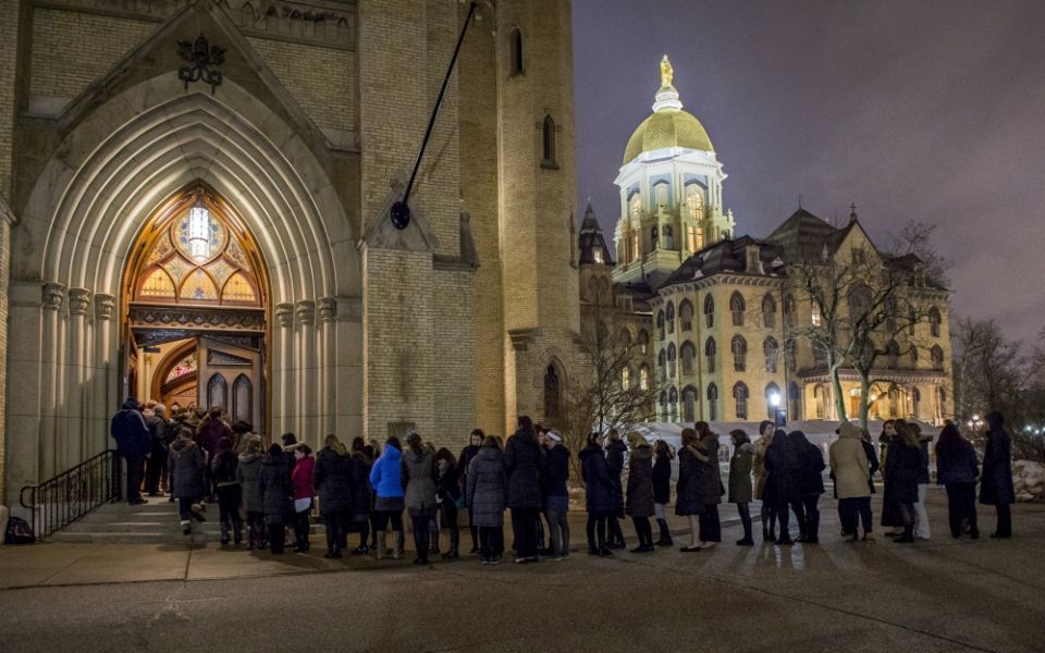 Students wait in line outside the Basilica of the Sacred Heart on the campus of the University of Notre Dame in 2015. (CNS/University of Notre Dame/Barbara Johnston)