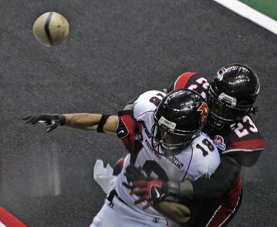 Alphonso Hodge (23) of the Gladiators breaks up a pass to Orlando player Kevin Nickerson (18) during a game at the Arena Football Playoffs at Quicken Loans Arena June 30, 2008 in Cleveland. Nickerson has served as Los Angeles Rams chaplain since 2016.