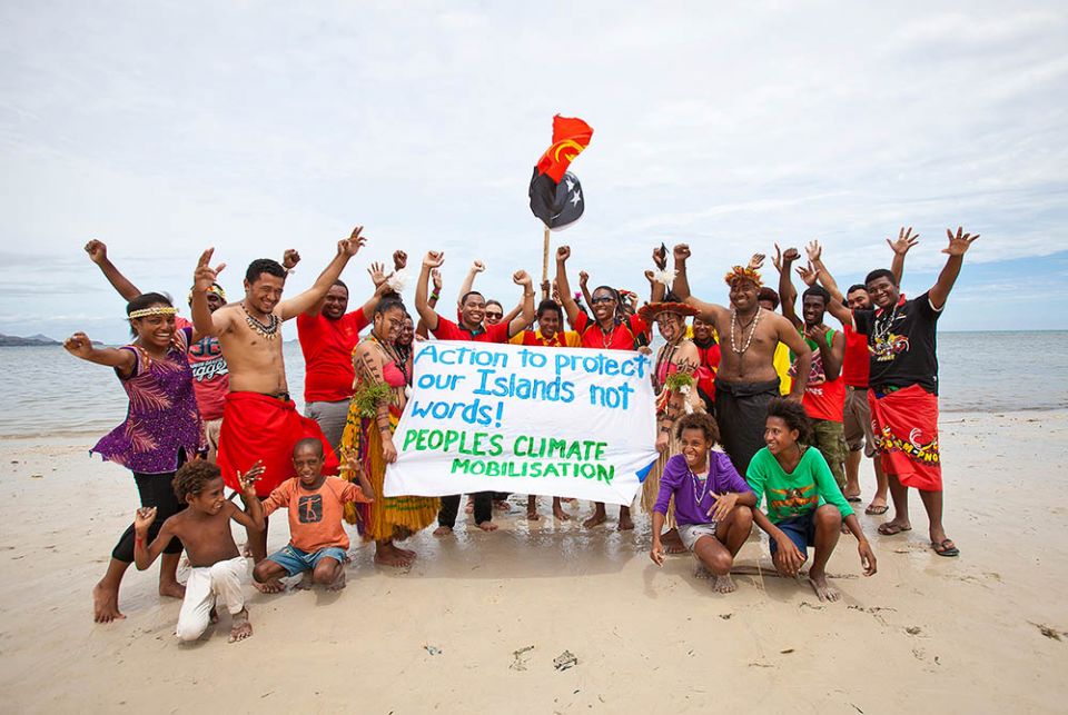 Members of the Pacific Climate Warriors in Papua New Guinea pose during an event. (Courtesy of Pacific Climate Warriors) Members of the Pacific Climate Warriors in Papua New Guinea pose during an event. (Courtesy of Pacific Climate Warriors)