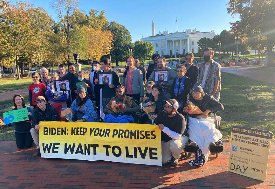 Participants in the All Saints' Day solidarity fast organized by Catholic Climate Covenant and the Ignatian Solidarity Network visit climate hunger strikers outside the White House in Washington, D.C. (Courtesy of Josh Burg)