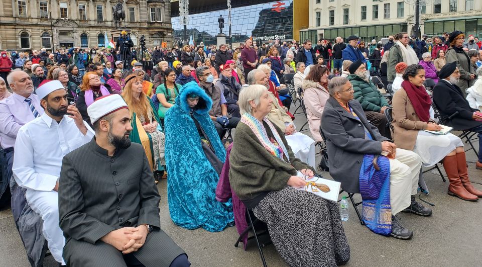 Participants listen to speakers during a multifaith prayer service on Oct. 31, the opening day of the U.N. climate conference in Glasgow, Scotland. (NCR/Brian Roewe)