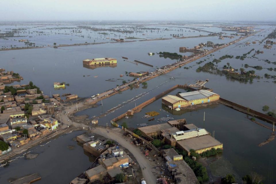 Homes are surrounded by floodwaters in Sohbat Pur city, a district of Pakistan’s southwestern Balochistan province, Aug. 29, 2022. (AP Photo/Zahid Hussain)
