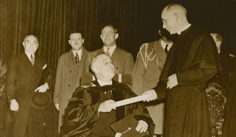 President Franklin D. Roosevelt, left, receives an honorary degree from University of Notre Dame President Holy Cross Fr. John F. O'Hara at a special convocation in December 1935. (Courtesy of University of Notre Dame Archives) President Franklin D. Roosevelt, left, receives an honorary degree from University of Notre Dame President Holy Cross Fr. John F. O'Hara at a special convocation in December 1935. (Courtesy of University of Notre Dame Archives)