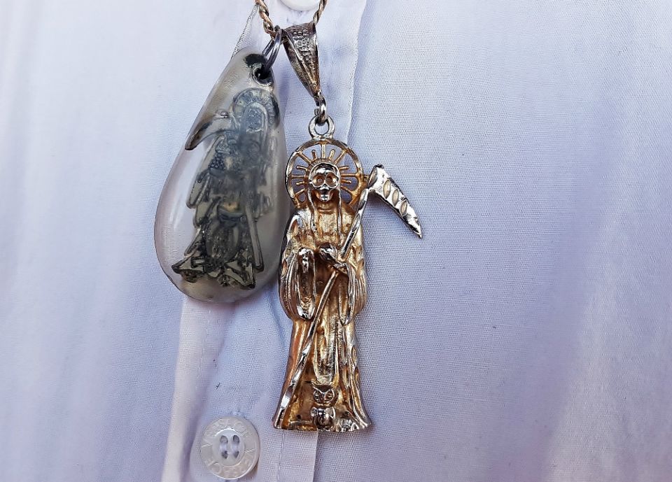 Silver pendants and other Santa Muerte paraphernalia are now popular across Mexico. (Stephen Woodman) Silver pendants and other Santa Muerte paraphernalia are now popular across Mexico. (Stephen Woodman)