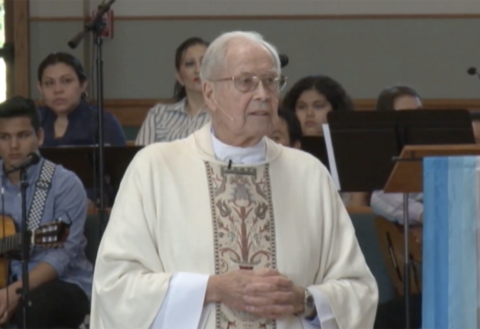 Fr. Michael Gillgannon preaches in Spanish and English during a Mass celebrating his 60 years as a priest on May 6, 2018, at St. Sabina Catholic Church in Belton, Missouri. (NCR screenshot/YouTube/Fr Michael Gillgannon)