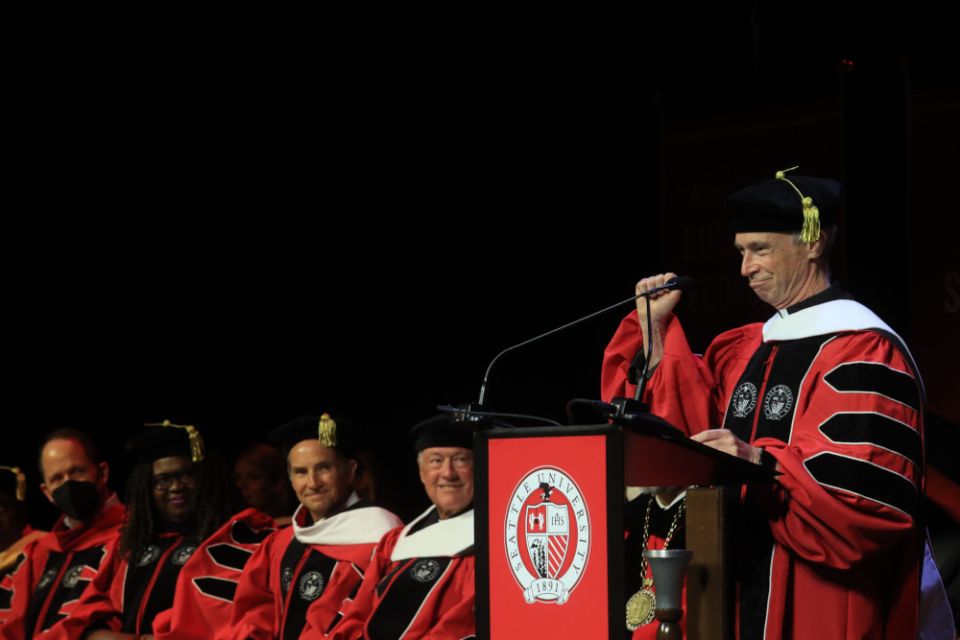 Jesuit Fr.  Thomas Reese speaks at the 2022 Seattle University graduation at Climate Pledge Arena in Seattle, June 12th, 2022. (RNS / Seattle University / Yosef Kalinko)