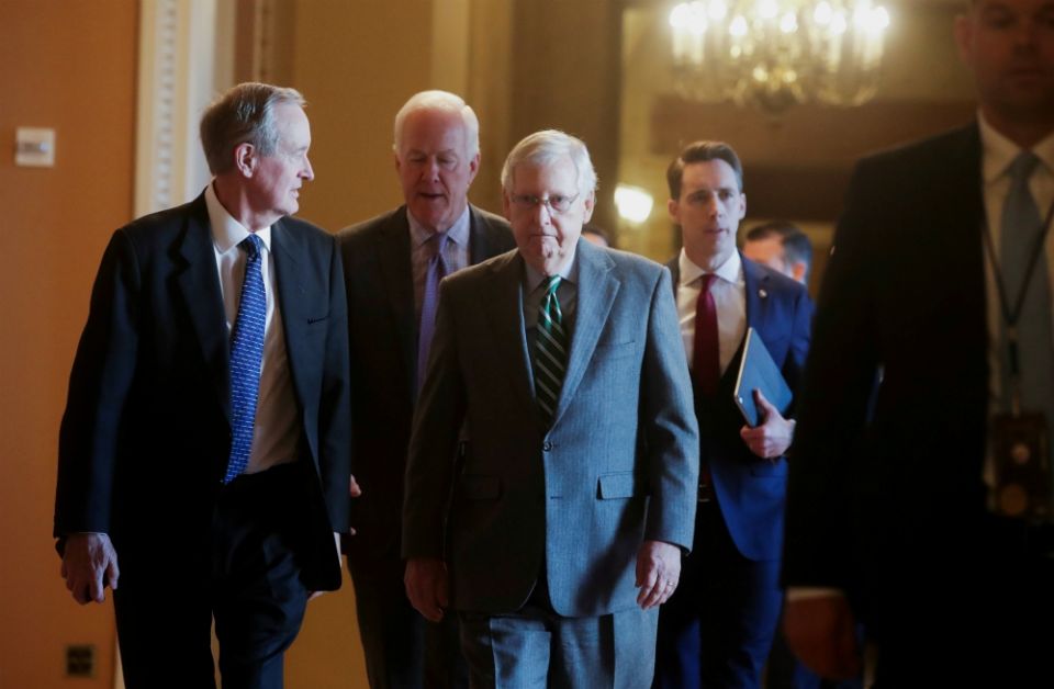 Senate Majority Leader Mitch McConnell, R-Kentucky, center, is seen with fellow Republican senators Jan. 16 at the U.S. Capitol in Washington. (CNS/Reuters/Jonathan Ernst) Senate Majority Leader Mitch McConnell, R-Kentucky, center, is seen with fellow Republican senators Jan. 16 at the U.S. Capitol in Washington. (CNS/Reuters/Jonathan Ernst)