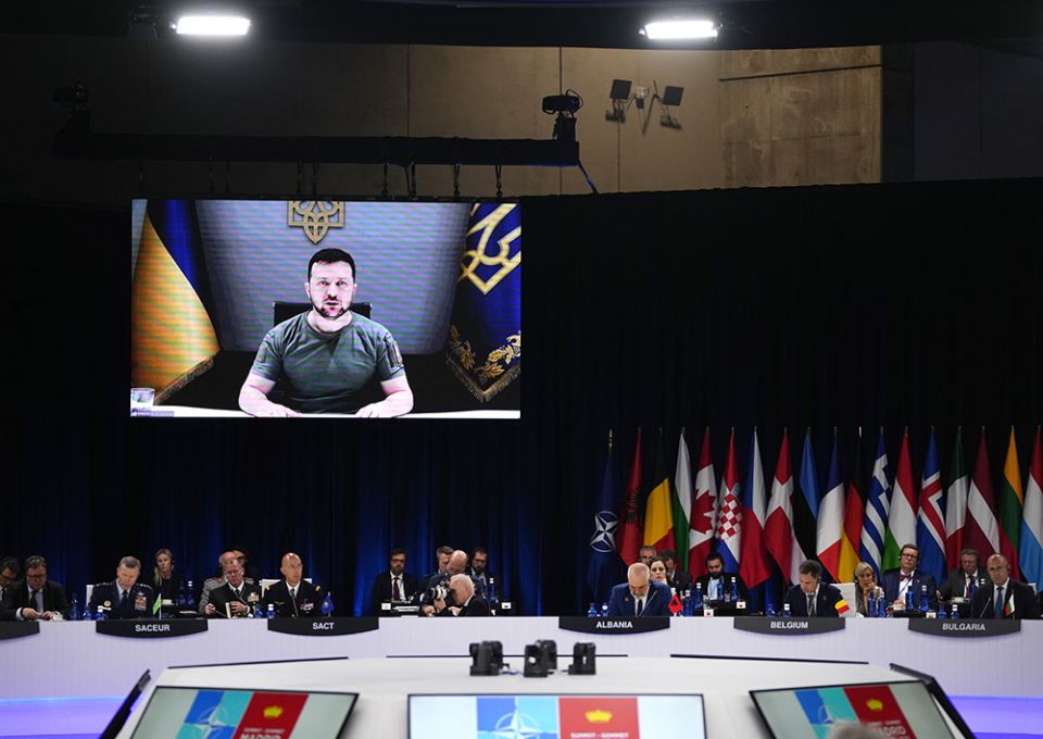 Ukraine's President Volodymyr Zelenskyy addresses leaders via a video screen during a roundtable meeting at a NATO summit in Madrid June 29. (AP/Manu Fernandez)