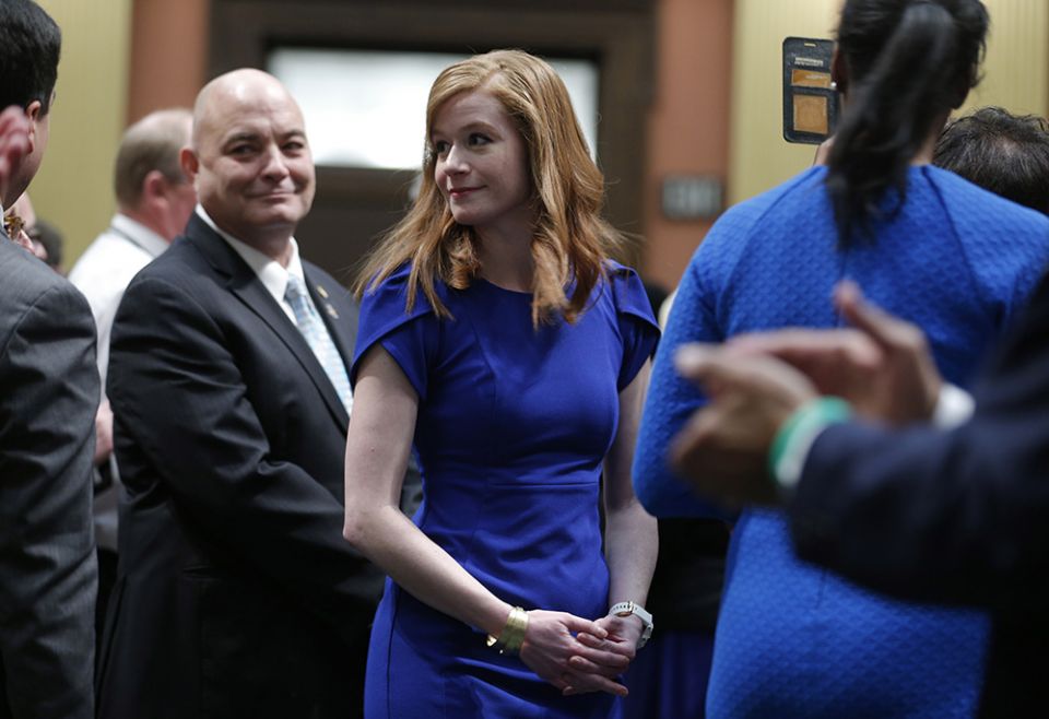 Michigan state Sen. Mallory McMorrow, center, is shown at the state capitol before the State of the State address, Jan. 29, 2020, in Lansing, Michigan. (AP photo/Al Goldis)