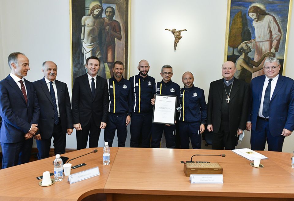 David Lappartient, third from left, presents official certification of the Athletica Vaticana sports club as a member of the International Cycling Union, Oct. 28 at the Vatican. (Courtesy of Athletica Vaticana) David Lappartient, third from left, presents official certification of the Athletica Vaticana sports club as a member of the International Cycling Union, Oct. 28 at the Vatican. (Courtesy of Athletica Vaticana)