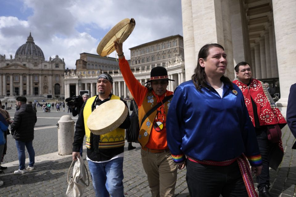 Indigenous artists from across Canada walk in St. Peter's Square, at the Vatican, Friday, April 1. (AP file photo/Alessandra Tarantino)