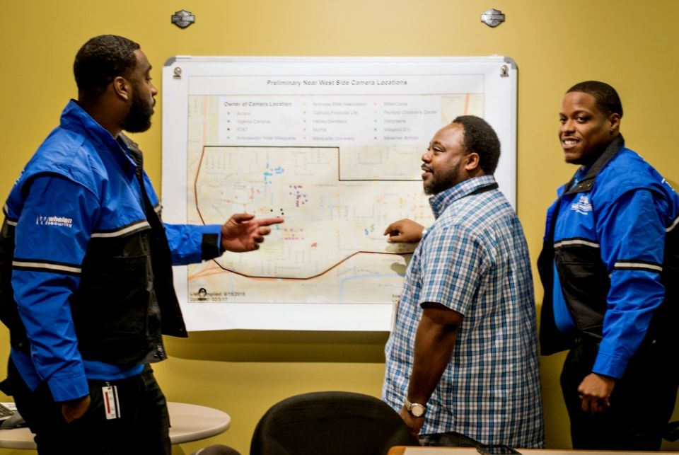 Community Prosecution Unit coordinator Bobby McQuay, center, and the Near West Side Partners ambassadors use geocoded data and resident input to address community identified issues on Milwaukee's Near West Side. (Courtesy of Near West Side Partners) Community Prosecution Unit coordinator Bobby McQuay, center, and the Near West Side Partners ambassadors use geocoded data and resident input to address community identified issues on Milwaukee's Near West Side. (Courtesy of Near West Side Partners)