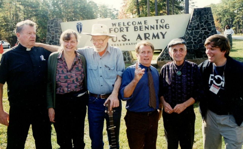 Davida and friends during the 1999 protest of the School of the Americas at Fort Benning, Georgia. From left: Fr. Bill O’Donnell, Davida Coady, Pete Seeger, Martin Sheen, Jesuit Fr. Dan Berrigan and Fr. John Dear. (Courtesy of Coady-Gorham family)