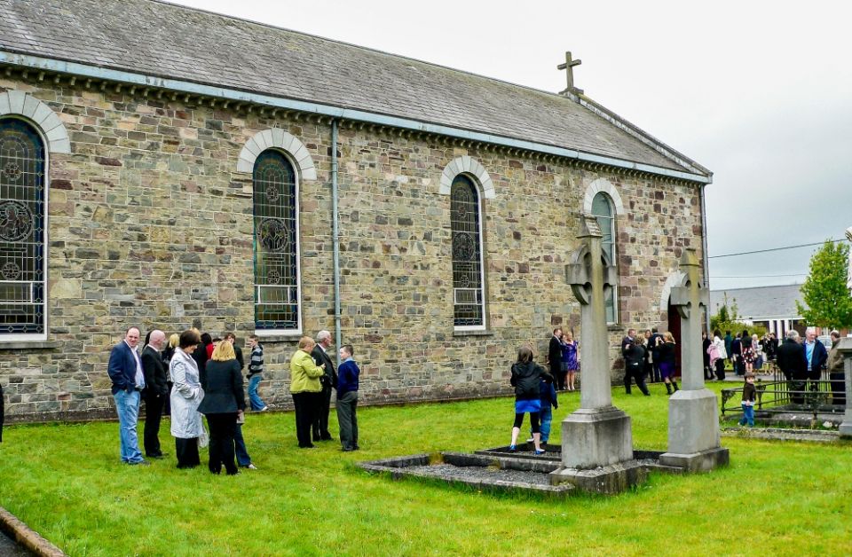 People chat after Mass outside a parish church in a small village in Ireland. (Dreamstime/Imagoinsulae)