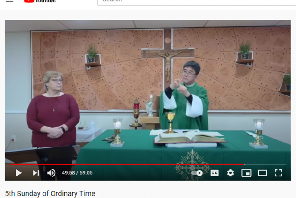 Fr. Min Seo Park signs the Mass in American Sign Language during a livestream Feb 6. Over 800 viewers watched via the Archdiocese of Washington Special Needs Ministry YouTube channel. (Screenshot by Joe Portolano/YouTube)
