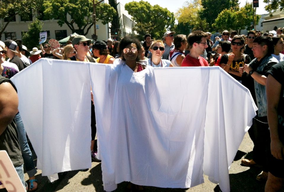 The presence of white-clothed angels with wide wings highlighted the spiritual character of the marchers. (Tom Webb) The presence of white-clothed angels with wide wings highlighted the spiritual character of the marchers. (Tom Webb)