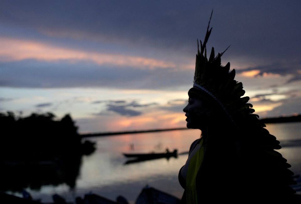 A leader of the Celia Xakriaba peoples walks along the banks of the Xingu River in Brazil's Xingu Indigenous Park Jan. 15. (CNS/Reuters/Ricardo Moraes)