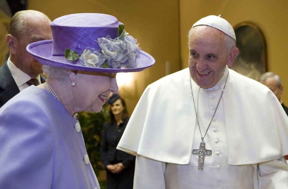 Britain's Queen Elizabeth II talks with Pope Francis during a meeting at the Vatican in this April 3, 2014, file photo.
