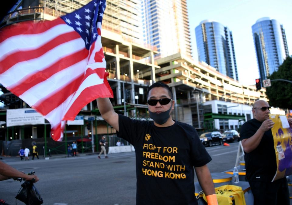 A fan wears a T-shirt supporting Hong Kong and holds a U.S. flag before an NBA game between the Los Angeles Lakers and the LA Clippers in that city Oct. 22. (Newscom/USA Today Sports/Kirby Lee) A fan wears a T-shirt supporting Hong Kong and holds a U.S. flag before an NBA game between the Los Angeles Lakers and the LA Clippers in that city Oct. 22. (Newscom/USA Today Sports/Kirby Lee)