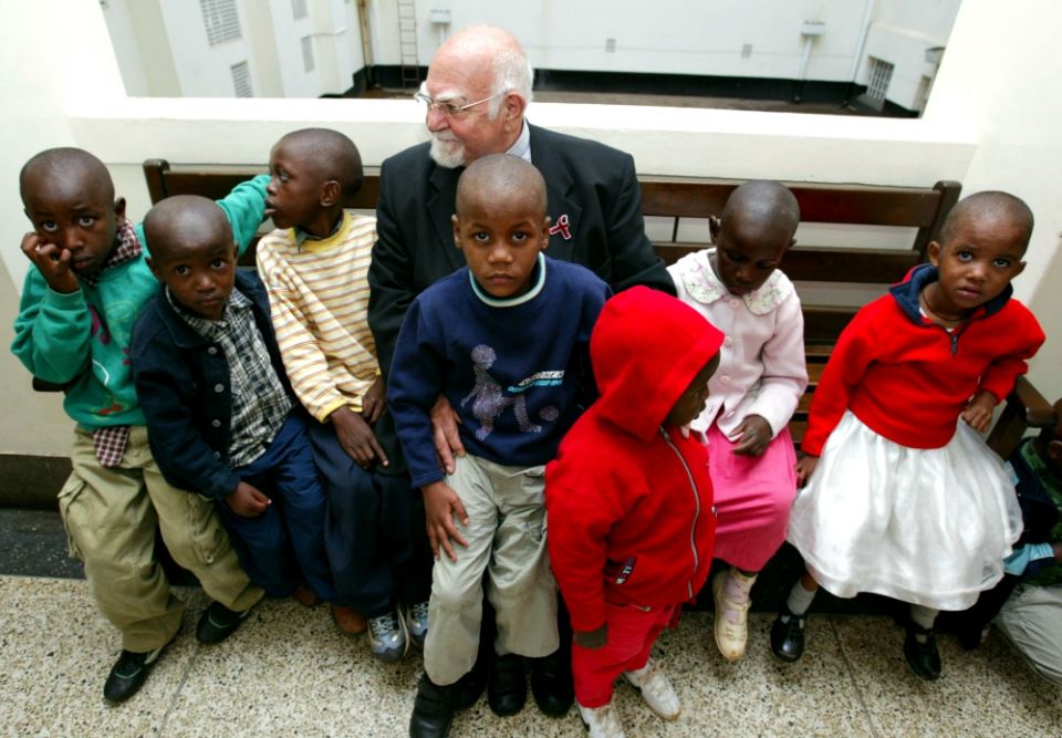 Jesuit Fr. Angelo D'Agostino, founder of Nyumbani children's home for HIV/AIDS orphans sits outside a courtroom in Nairobi, Kenya, in January 2004. (Newscom/Reuters/Antony Njuguna)