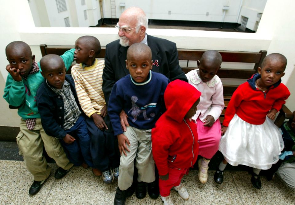 Jesuit Fr. Angelo D'Agostino, founder of Nyumbani children's home for HIV/AIDS orphans sits outside a courtroom in Nairobi, Kenya, in January 2004. (Newscom/Reuters/Antony Njuguna) Jesuit Fr. Angelo D'Agostino, founder of Nyumbani children's home for HIV/AIDS orphans sits outside a courtroom in Nairobi, Kenya, in January 2004. (Newscom/Reuters/Antony Njuguna)