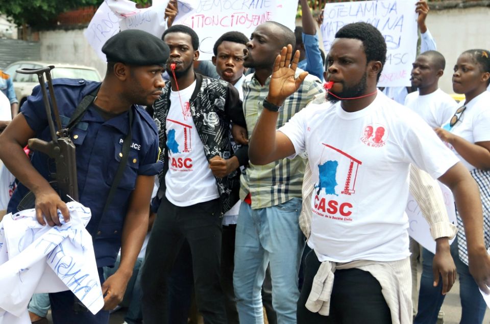 Police officers attempt to disperse members of the Civil Society Action Collective chanting slogans in a demonstration calling for free and fair elections Sept. 19 in Kinshasa, Democratic Republic of Congo. (Newscom/Reuters/Kenny Katombe) Police officers attempt to disperse members of the Civil Society Action Collective chanting slogans in a demonstration calling for free and fair elections Sept. 19 in Kinshasa, Democratic Republic of Congo. (Newscom/Reuters/Kenny Katombe)