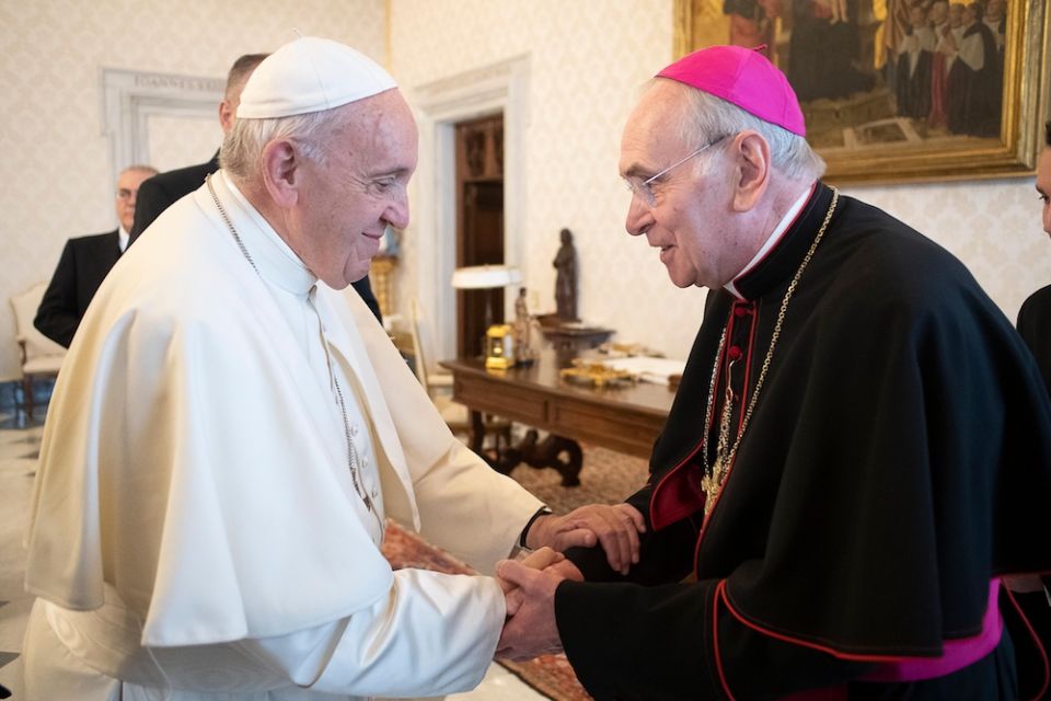 Bishop Roger J. Foys, who is retiring as prelate of the Diocese of Covington, Kentucky, is pictured with Pope Francis during an "ad limina" visit to the Vatican in December 2019. (CNS photo/Vatican Media)