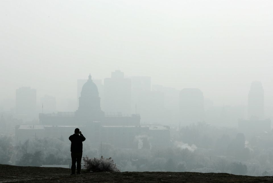 A man stops to take a picture of the Utah State Capitol and buildings that are shrouded in smog in downtown Salt Lake City Dec. 12, 2017. (CNS/Reuters/George Frey) A man stops to take a picture of the Utah State Capitol and buildings that are shrouded in smog in downtown Salt Lake City Dec. 12, 2017. (CNS/Reuters/George Frey)