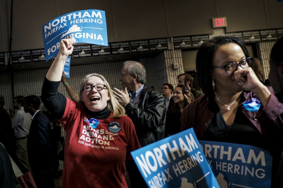 Constituents at the official Democratic watch party at George Mason University in Fairfax, Virginia, react to the news that Ralph Northam won the governor's race against Republican Ed Gillespie Nov. 7. (Newscom/UPI/Pete Marovich)