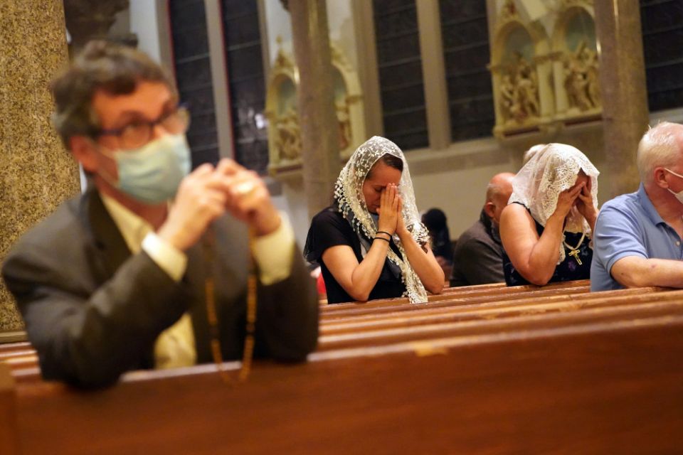 People pray during a traditional Latin Mass Aug. 11, 2020, at Our Holy Redeemer Church in Freeport, New York. (CNS/Gregory A. Shemitz)