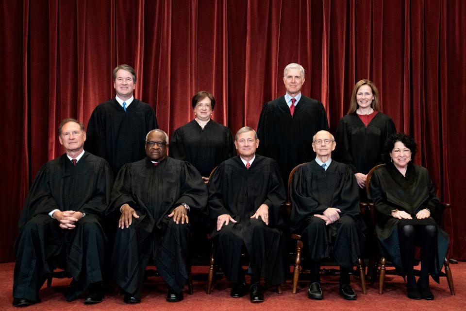 The justices of the U.S. Supreme Court pose for a group photo at the court in Washington April 23, 2021. (CNS/pool via Reuters/Erin Schaff) 