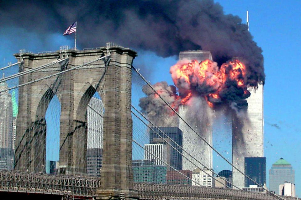 Both towers of the World Trade Center in New York City burn after being hit by planes Sept. 11, 2001. (CNS/Reuters/Sara K. Schwittek)
