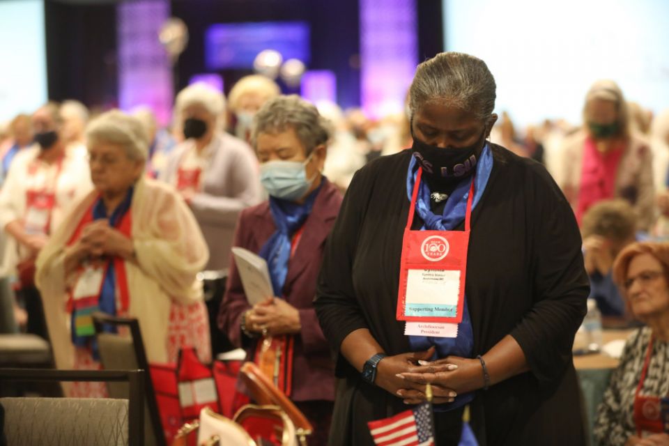 Members of the National Council of Catholic Women pray during Mass at the Crystal Gateway Marriott Aug. 26 in Arlington, Virginia. (CNS/Catholic Standard/Andrew Biraj)