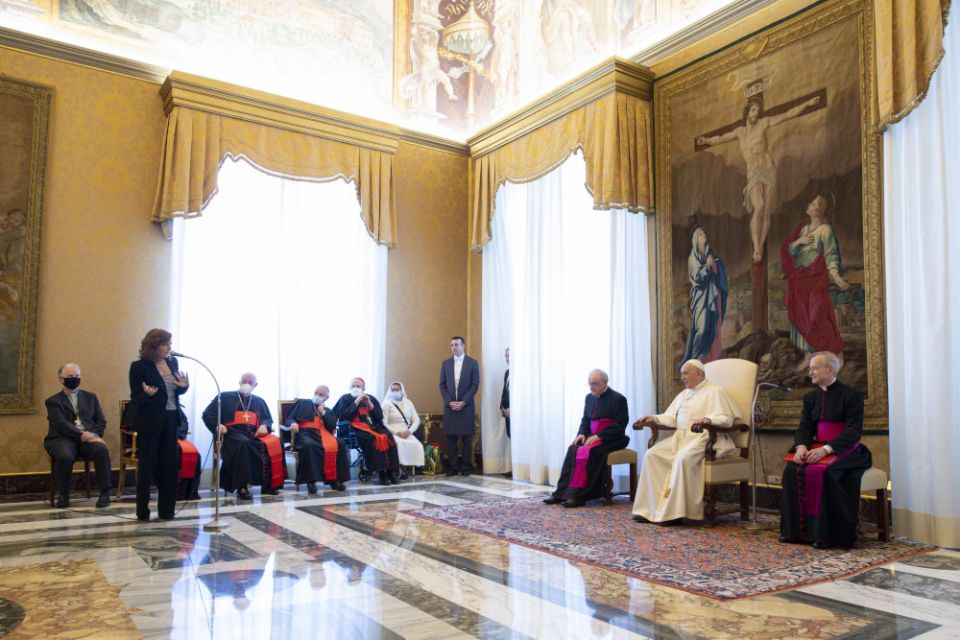 Pope Francis listens as Valentina Alazrak of Televisa speaks during a ceremony to honor Alazrak and journalist Philip Pullella of Reuters in the Apostolic Palace at the Vatican Oct. 13, 2021. (CNS/Vatican Media)