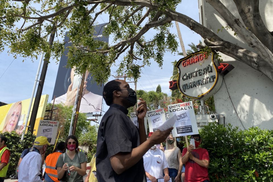 Jesuit Fr. Ike Udoh, center, joins a June 15, 2021, protest in front of Chateau Marmont in Hollywood, California. (Photo courtesy of Maria Hernandez/United Here Local 11)