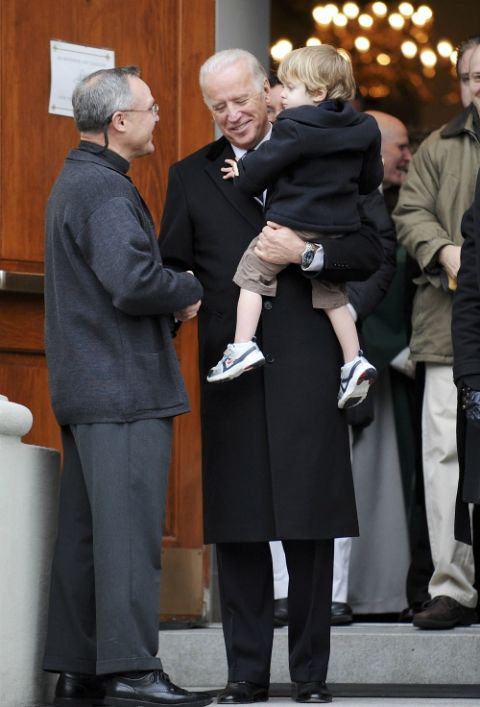 Joe Biden, then vice president-elect, holds his grandson Hunter Biden and shakes hands with Jesuit Fr. Mark Horak following Mass at Holy Trinity Church in Washington Jan. 18, 2009. (CNS/Reuters/Jonathan Ernst) Joe Biden, then vice president-elect, holds his grandson Hunter Biden and shakes hands with Jesuit Fr. Mark Horak following Mass at Holy Trinity Church in Washington Jan. 18, 2009. (CNS/Reuters/Jonathan Ernst)