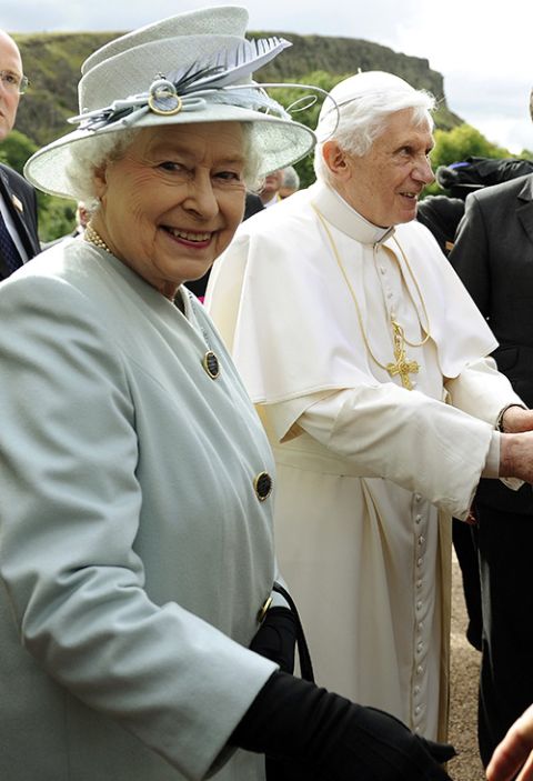 Queen Elizabeth II and Pope Benedict XVI walk through the gardens at the Royal Palace of Holyroodhouse in Edinburgh, Scotland, Sept. 16, 2010. (CNS/Reuters/Dylan Martinez)