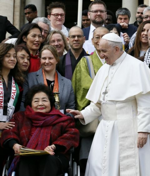 Pope Francis greets Setsuko Thurlow, a survivor of the 1945 atomic bombing in Hiroshima, Japan, during his general audience in St. Peter's Square at the Vatican March 20. (CNS/Paul Haring)