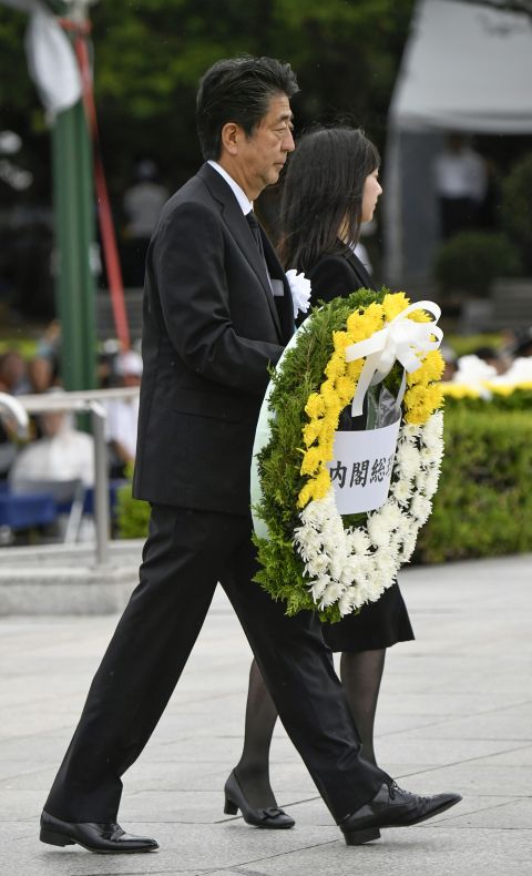 Japanese Prime Minister Shinzo Abe carries a wreath for the victims of the 1945 atomic bombing at Peace Memorial Park in Hiroshima, Japan, Aug. 6. (CNS/Kyodo via Reuters)