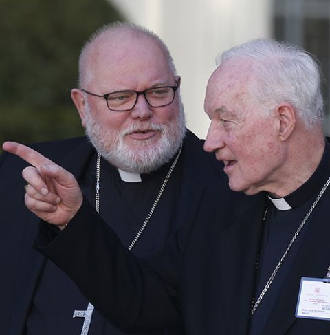 Cardinal Reinhard Marx of Munich and Freising, Germany, and Cardinal Marc Ouellet talk as they leave a session of the Synod of Bishops for the Amazon at the Vatican Oct. 21, 2019. (CNS/Paul Haring)