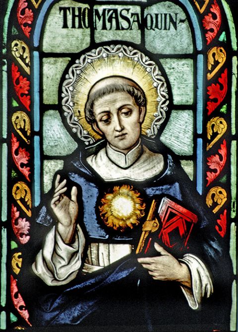St. Thomas Aquinas is seen in stained glass at the Basilica of Our Lady of the Immaculate Conception in Guelph, Ontario. (CNS/The Crosiers/Gene Plaisted)
