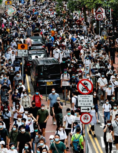 Demonstrators march during a protest against the national security law in Hong Kong July 1. (CNS/Reuters/Tyrone Siu)