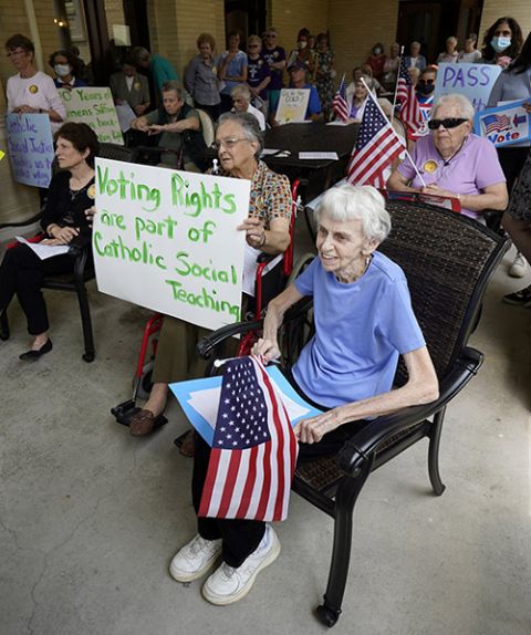 Women religious and laypeople attend a rally at the Sisters of St. Joseph motherhouse in Brentwood, New York, July 26, urging U.S. Congress to pass the voting-rights For the People Act. (CNS/Gregory A. Shemitz)