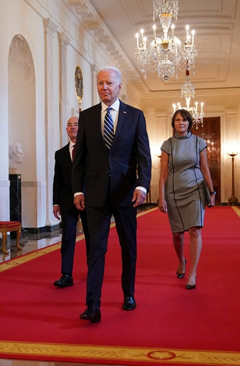 President Joe Biden arrives with Homeland Security Secretary Alejandro Mayorkas and Tracy Renaud, acting director of U.S. Citizenship and Immigration Services, for a naturalization ceremony at the White House in Washington July 2. (CNS/Reuters)